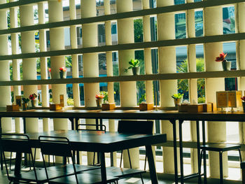 Empty chairs and tables in restaurant