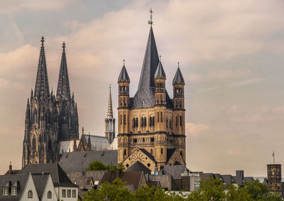 Tower of buildings in city against sky