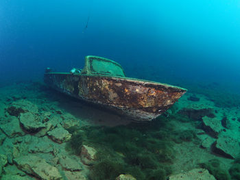 Abandoned boat in sea