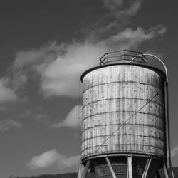 Low angle view of smoke stack against sky