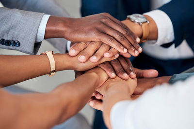 Midsection of doctor giving handshake