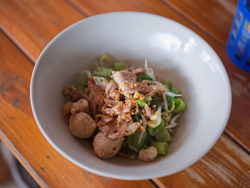 Thai noodle beef is very delicious on wood table