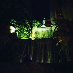 Low angle view of illuminated building at night