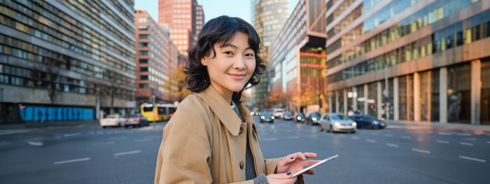 Young woman standing in city