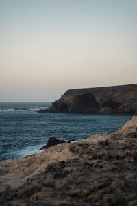 Scenic view of sea against clear sky