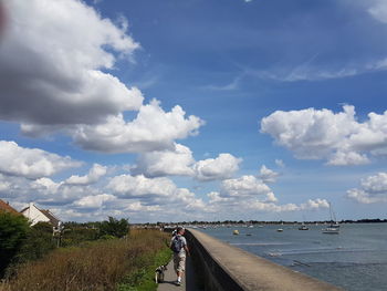 Scenic view of beach against blue sky