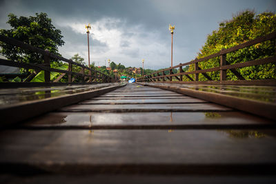 Surface level of railroad tracks against sky