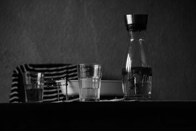 Close-up of wine glasses on table