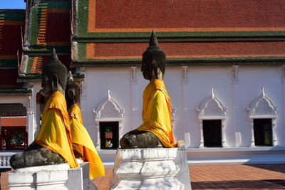 Statue of buddha outside building