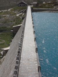 High angle view of footbridge and dam