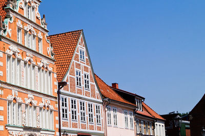 Low angle view of hanse buildings against clear sky