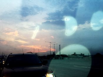 View of road against cloudy sky