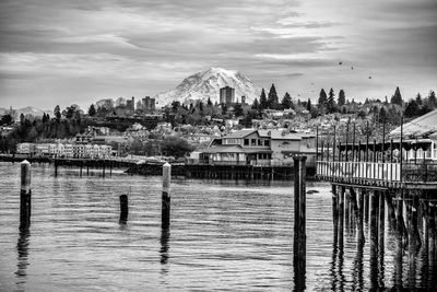 A view of buildings in tacoma, washington with mount rainier behind.