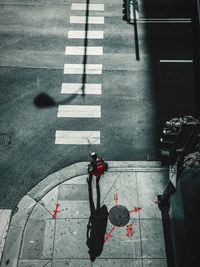 High angle view of people crossing road