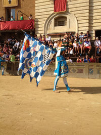 Group of people in traditional clothing during festival