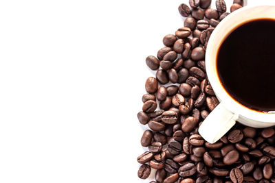 Close-up of coffee beans against white background