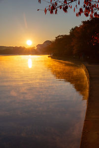 Scenic view of lake against sky during sunset