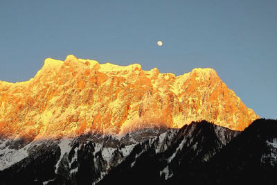 Scenic view of snow covered mountain against sky