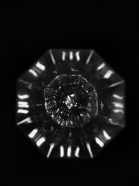 Close-up of electric lamp against black background