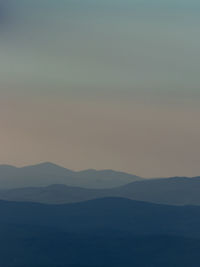 Scenic view of silhouette mountain against sky during sunset