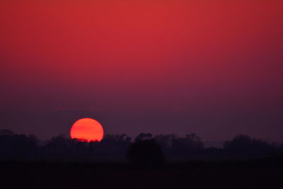 Scenic view of silhouette landscape against sky during sunset