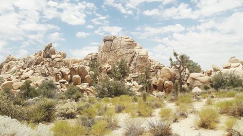 Panoramic view of arid landscape against sky