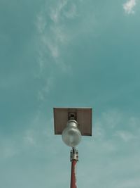 Low angle view of street light against sky