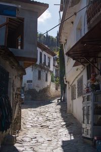 Houses in city against sky