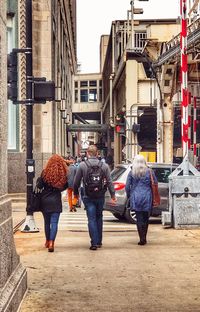 People walking on street in city