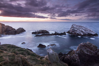 Scenic view of sea against cloudy sky
