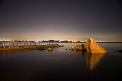 Scenic view of sea against clear sky during sunset