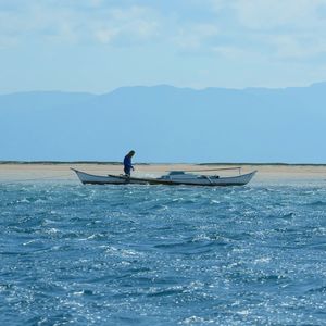 Side view of boat in calm blue sea