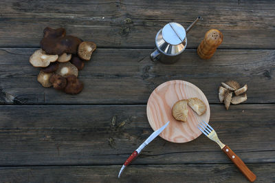 High angle view of mushrooms on wooden table