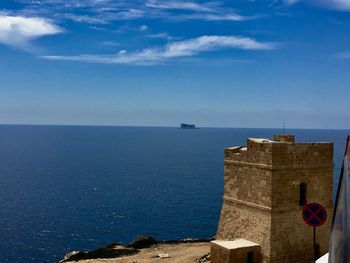 Scenic view of sea against blue sky