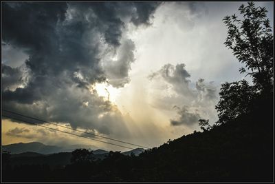 Scenic view of landscape against cloudy sky