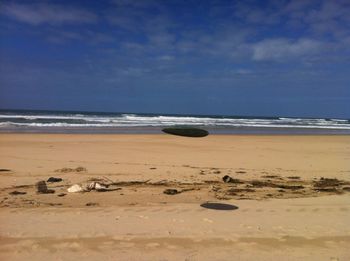 Scenic view of beach against sky