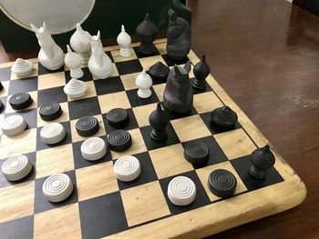 High angle view of chess pieces on table