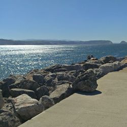 Scenic view of sea against clear blue sky