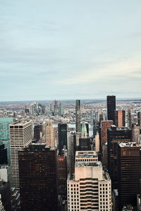 High angle view of modern buildings in city against sky