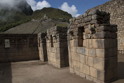 View of old ruins against cloudy sky