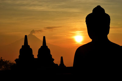 Silhouette of temple at sunset