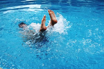 Man swimming in pool