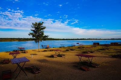 Scenic view of beach against blue sky