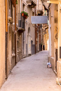 Alley amidst buildings in city