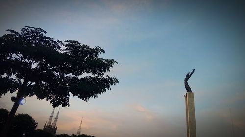 Low angle view of silhouette tree against sky at sunset