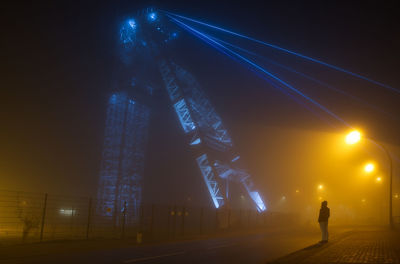 Low angle view of illuminated city at night