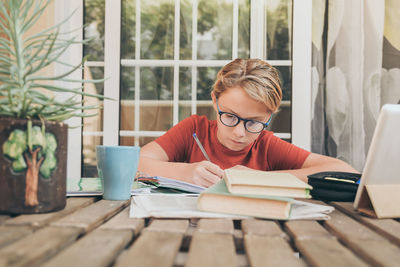 Boy studying at table