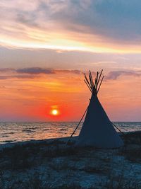 Scenic view of sea against orange sky