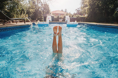 Man swimming in pool