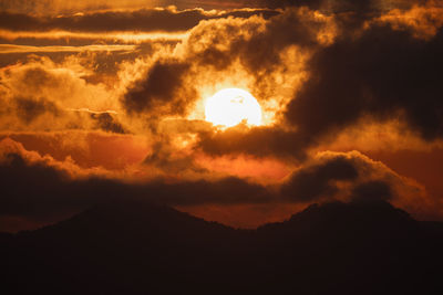Low angle view of dramatic sky during sunset